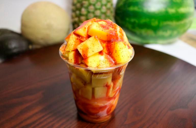 Regular Mangonada  · Delicious mango ice cream with pieces of fresh mango topped off with chamoy and Tajin.
