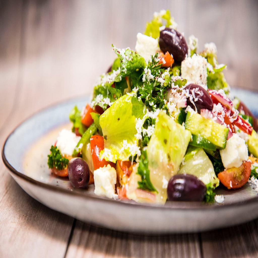 Greek Salad · Romaine hearts, tomato, onion, cucumber, feta, olives, house dressing.