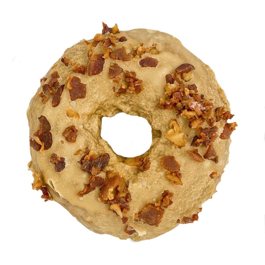 KGF Maple Bacon · While we’re known for our traditional Maple Bacon Donut, our KGF version lives up to its cousin’s hype. We top our KGF Plain Donut with a rich maple syrup glaze and tons of rough-chopped cherrywood-smoked bacon.