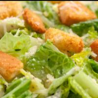 Caesar Salad · Romaine, herb croutons and Parmesan cheese with Caesar dressing.