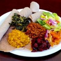 Ethiopian Vegetarian Combo (Vegan) · Ethiopian flat bread (Injera) combination of Misir wot(Red lentils kik Alitcha (yellow Split...