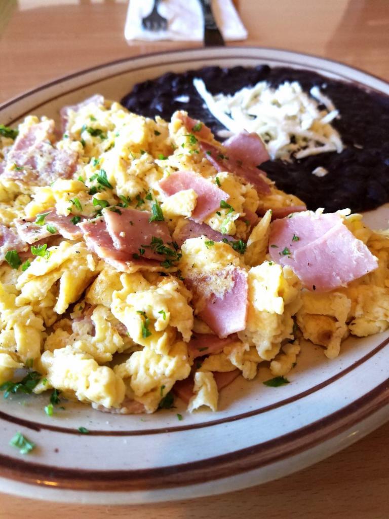 Huevos con Jamon  · Todo Mexico. Scrambled eggs with ham. Served with black beans and 2 corn tortillas.