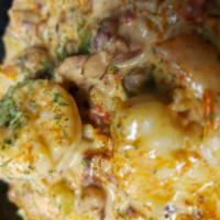 Shrimp with Grits · This tasty delight contains andouille sausage, sun-dried tomatoes, garlic, onions, bell pepp...