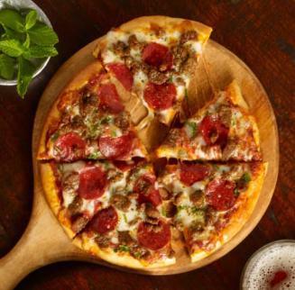 Meat-Eater Pizza · Marinara Sauce, Mozzarella, Italian Sausage, Pepperoni, Seasoned Hamburger, Scallions 