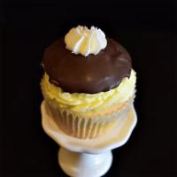Boston Cream · Yellow cake dipped in chocolate and filled with vanilla cream.
