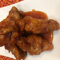 7 Piece Spicy Wings · Chicken wings with hot sauce.