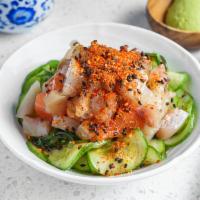 Seafood Poki · Diced assorted fish over seaweed and cucumber in yuzu wasabi sauce and seven-flavor chili pe...