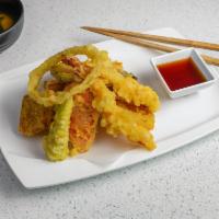 Mix Tempura · Battered and deep fried shrimps and vegetables with dipping tempura sauce.