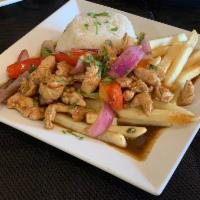 Pollo Saltado · No substitutions. Tender chicken mixed with onions and tomatoes. Served over french fries an...