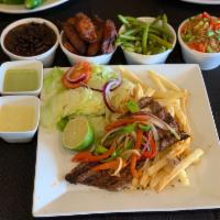Carne Asada · Tender steak with green red peppers, and onions served with 2 sides.