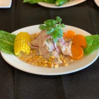 Ceviche de Pescado · Fresh fish in juice mixed with special spices with sweet potato, and Peruvian corn.
