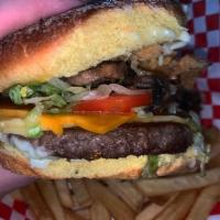 Badass Burger · Potato bun, Impossible 2.0 burger patty, vegan cheddar cheese, badass sauce, lettuce, tomato...