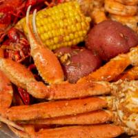  Seafood  Combo 4  (1/2 lb) · 1/2 lb. shrimp head off,  1/2  Cluster snow crab, 1 piece lobster tail,  corn,  pieces potat...