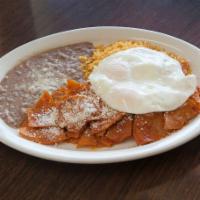Chilaquiles con Huevo · Fried corn tortillas in choice of spicy red or green sauce and topped with Parmesan cheese. ...