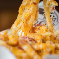 Crib Seasoned Cheese Fries · Fried potatoes topped with cheese. Add add-ons and proteins for an additional charge. 