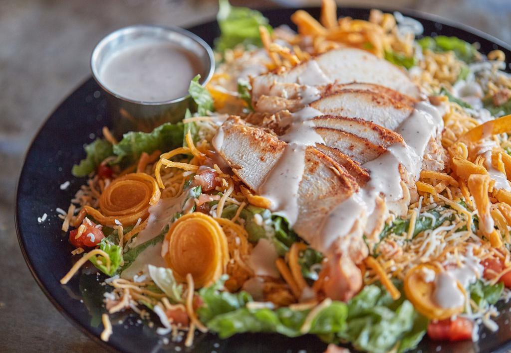 Smoked Chicken Salad · Choice of meat over fresh greens, topped with tomato, cheese, tortilla strips, and your choice of dressing.
