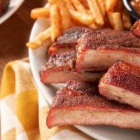 St. Louis Ribs · A 1/2-rack of our righteous ribs and 2 sides.