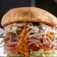 Carolina Pulled Pork Sandwich · Pulled pork topped with coleslaw, lettuce, tomato, and our Carolina mustard sauce on a bun. ...