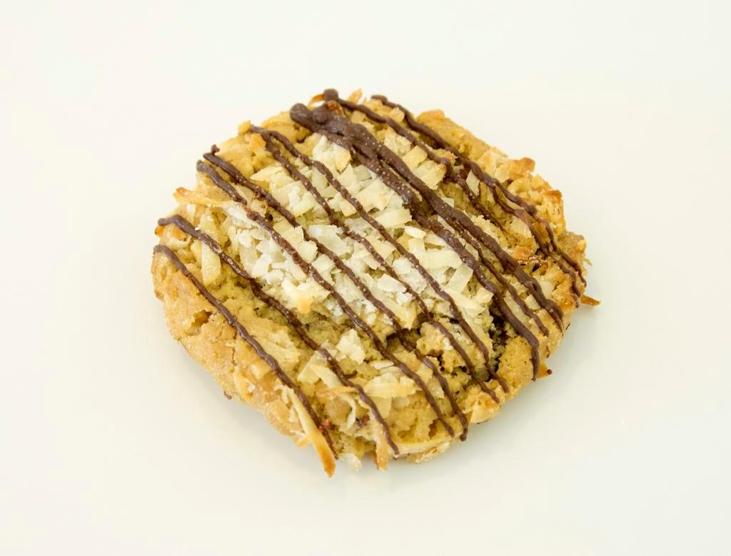 Almond Joyous Cookie · * contains tree nuts (almonds, coconuts) * Dough: Toasted Coconut and Almond. Mix-ins: toasted coconut, dark chocolate and toasted almonds. Topping: Dark Chocolate Drizzle
