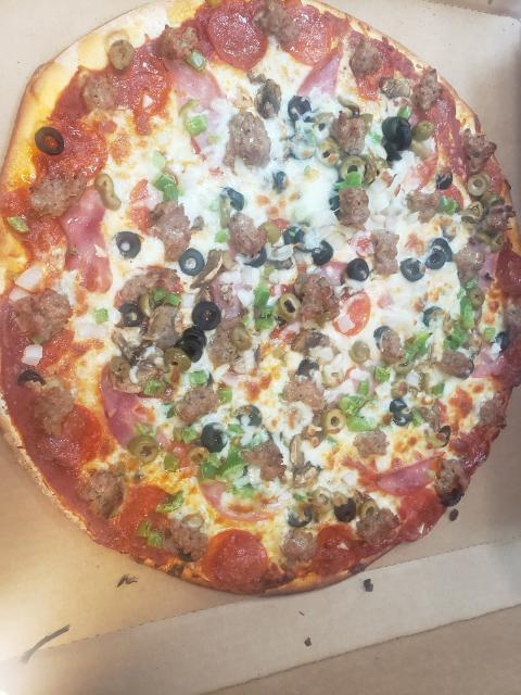 16'' Jumbo Deluxe Pizza · Our signature marinara sauce, mozzarella cheese, Canadian bacon, pepperoni, fresh mushrooms, black olives, green olives, white onions, green peppers, Italian sausage, and topped off with more mozzarella cheese.