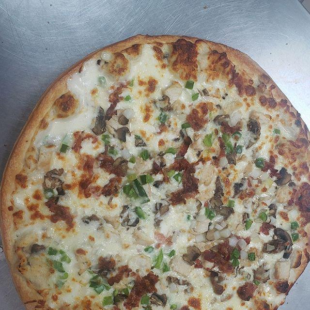 10'' Small Loaded Chicken Alfredo Pizza · Our signature pizza man Alfredo sauce, mozzarella cheese, real white chicken meat, fresh mushrooms, white onions, green peppers, real bacon bits, and topped off with more mozzarella cheese.