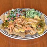 Emily's Nachos · Chips topped with refried beans, melted nacho cheese, pico de gallo salad, guacamole and cho...