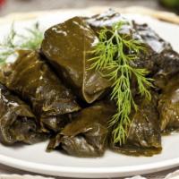 Vegetarian Grape Leaves Plate · Stuffed grape leaves with rice and mild spices.