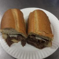Steak and Cheese Grinder · With onions and green peppers.