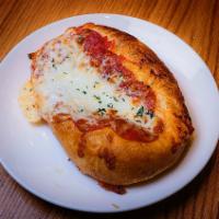 Pepperoni Focaccia · Olive oil infused focaccia dough topped with pepperoni , onions and melted cheese