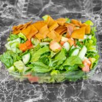 Fattoush Salad · Romaine lettuce, tomatoes, cucucmbers, summac, parsley topped with toasted pita chips.
