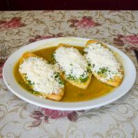 Tlacoyo · Salsa verde, cilantro, onions and cheese.