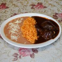 Mole con Pollo · Served with rice and beans.