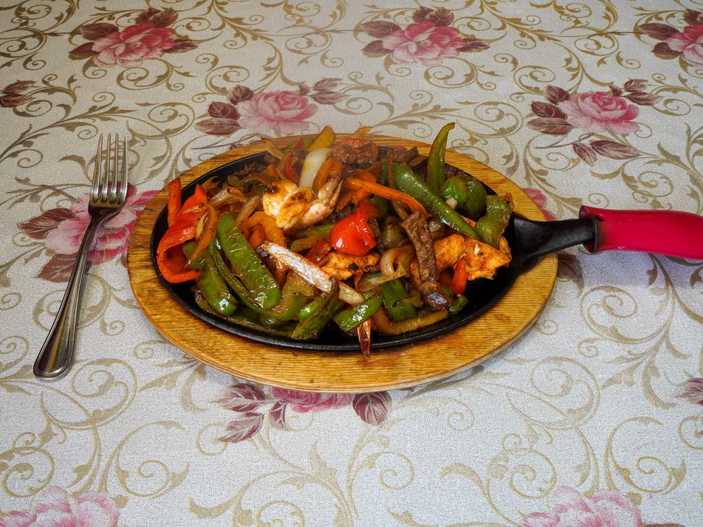 Mix Fajitas · Served with rice, beans and salad.