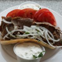 Gyros Sandwich · Served on pita with onion, tomatoes, and sauce on the side. 