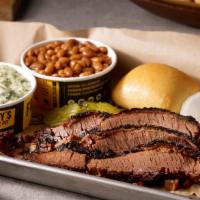 Brisket Plate · Slow smoked Brisket, two delicious sides and a yeast roll.