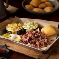 Pulled Pork Plate · Slow smoked Pork, two delicious sides and a yeast roll.