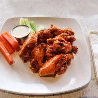 Chicken Wings · Choice of traditional or boneless wings, and choice of sauces or dry rubs.