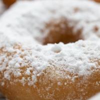 Dutch Crumb · A soft cake donut covered in glaze & dipped in powdered sugar, sprinkled with fresh cinnamon.