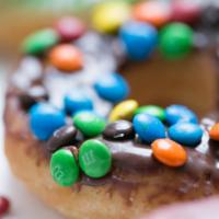Chocolate M&M's · A donut dipped in chocolate & sprinkled with M&M's.