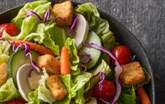 Individual Garden Salad · Fresh, mixed green salad with mushrooms, tomatoes, carrots, cucumbers and garlic Parmesan cr...