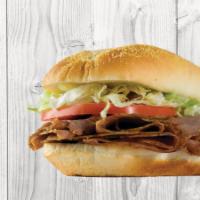 Deluxe Roast Beef · Tender rax roast beef sliced thin and stacked on a 6