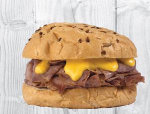 Beef N Cheddar · Tender rax roast beef sliced thin and stacked on an onion bun with cheddar cheese sauce.