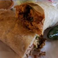 Burrito · Large burrito made with flour tortillas and mixed with fried beans, rice, cheese, onions, ci...