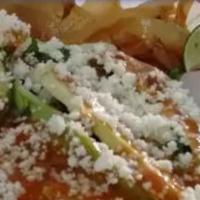 Sope · Small bed of masa dough, topped with fried beans, cheese, your choice of meat, lettuce, toma...