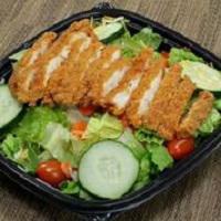 spicy chicken salad · fried chicken breast served on top of romaine lettuce, cherry tomatoes, cucumbers, carrots a...