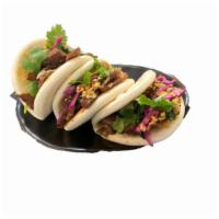 Bao Bun  · Beef Meat, Hoisin Sauce, Lettuce, Fried garlic. It comes with 3 of them in one order.