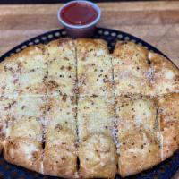 Garlic Bread · Our garlic bread is topped with diced garlic, then fresh baked and topped with garlic butter...