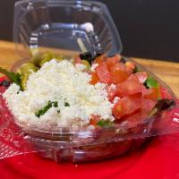 Greek Salad · Spring Mix Greens, Black Olives, Green Olives, tomato, Feta and Choice of Dressing.
