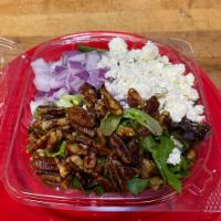 Raspberry Pecan Salad · Spring Mix Greens, Feta, Onion, Candied Pecans and Raspberry Vinaigrette.