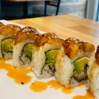 Plantain Roll · Fried white fish, avocado, cream cheese, topped with fried sweet plantain, seed and eel sauce.